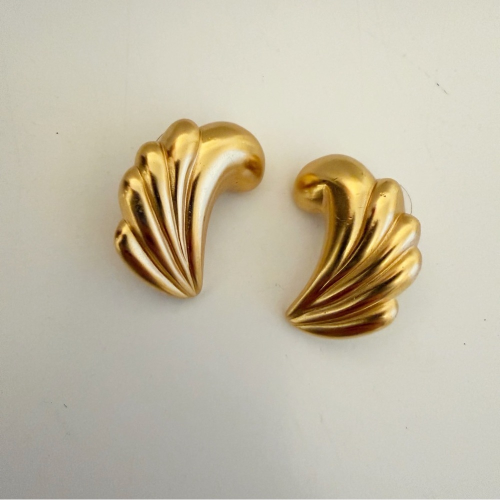 Vintage gold-plated, fluted, or ribbed wave design earrings.